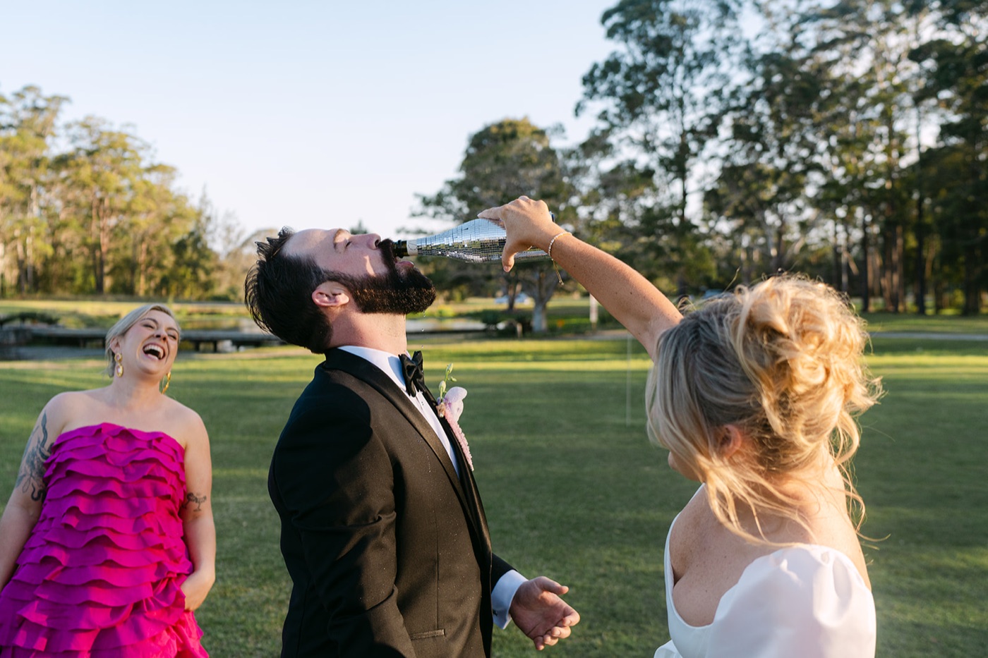 Groom laughing with the bridal party